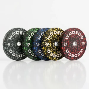 Set of five speckled weight plates (5–25 kg) lined up on a white surface, from dark to red color schemes.