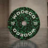 10 kg black weight plate with green speckled pattern and white 'WODECO' text displayed at the center and edge.