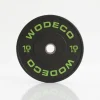 Black 10 kg weight plate with bright green 'WODECO' lettering around the edge.